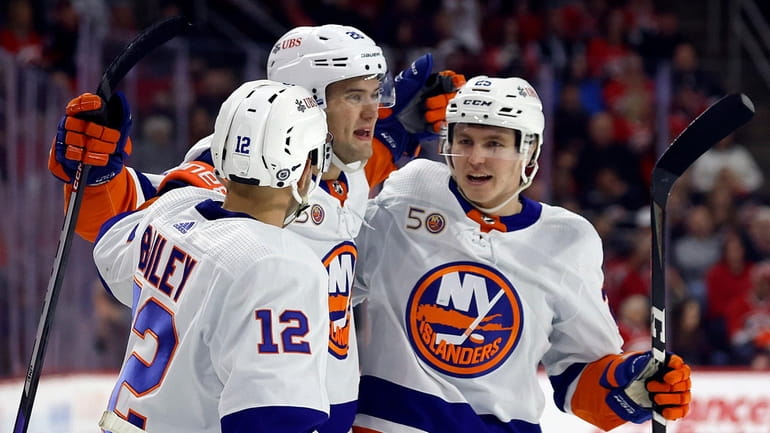 New York Islanders' Oliver Wahlstrom (26) is congratulated on his...