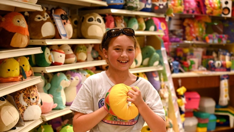 Sadie Bernius, 9, of Bayport, plays with a Squishmallow while...