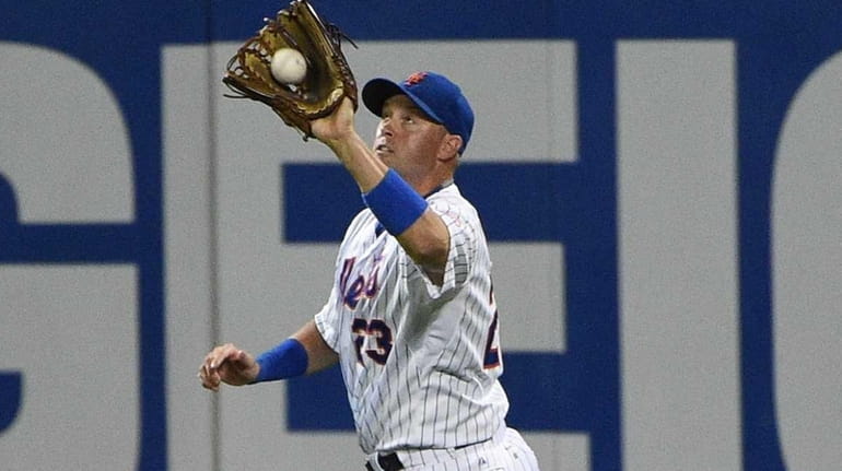 New York Mets right fielder Michael Cuddyer makes the catch...