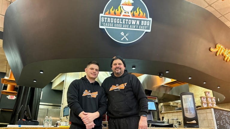 John and Jake Leonard, father-and-son owners of Struggletown BBQ in...