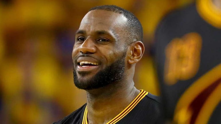 LeBron James #23 of the Cleveland Cavaliers smiles during the...