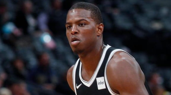 Nets guard Isaiah Whitehead, left, drives the lane past Nuggets...