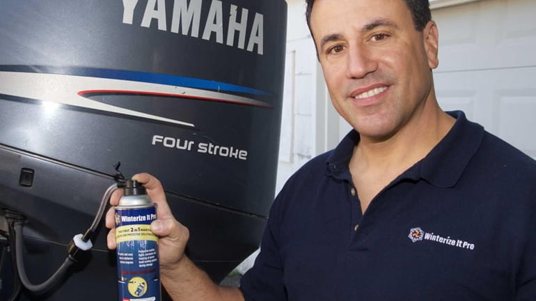 John Drakos with a can of his product, Winterize it...