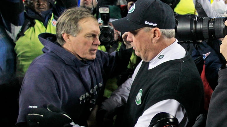 Patriots head coach Bill Belichick, left, congratulates Jets counterpart Rex...