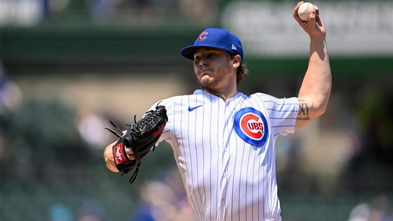 Chicago Cubs pitcher Justin Steele (35) throws during the first...