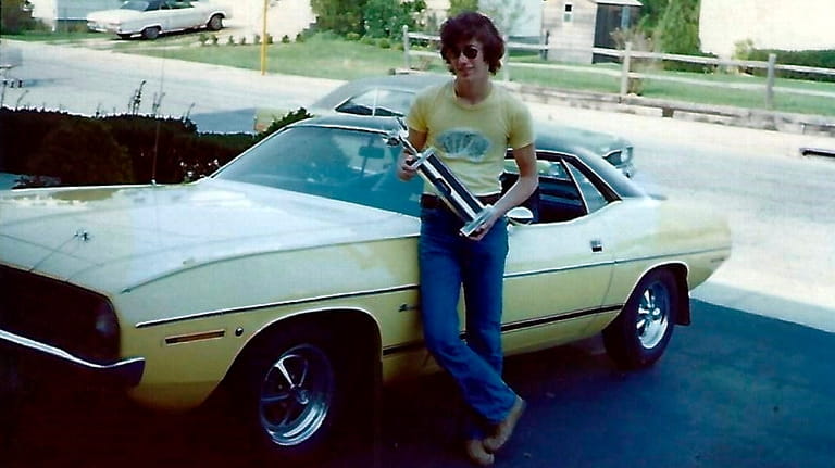 Steve Linden, in an undated photo, stands by his Plymouth Barracuda.