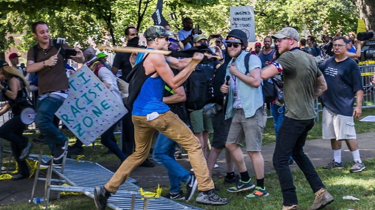 White supremacist groups and counter-protesters clash at a demonstration earlier...