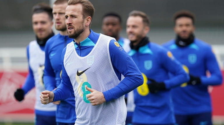 England's Harry Kane warms up during a training session ahead...