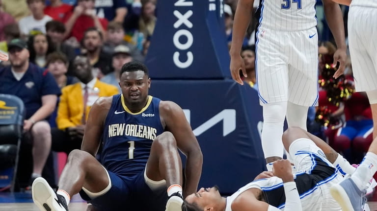 New Orleans Pelicans forward Zion Williamson (1) gets up off...