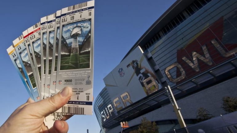 Super Bowl XLV tickets are held outside Cowboys Stadium.