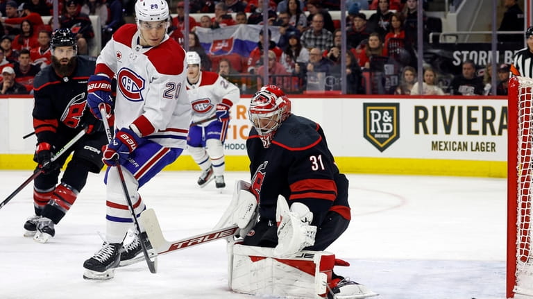 Montreal Canadiens' Juraj Slafkovsky (20) watches as the puck goes...