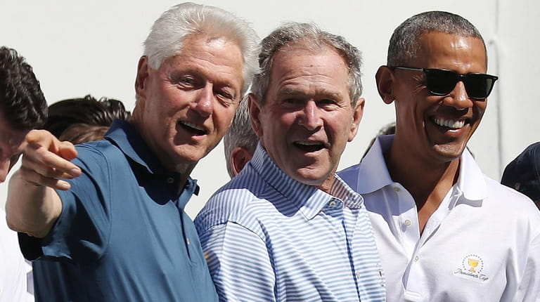Bill Clinton, George W. Bush and Barack Obama, shown in...