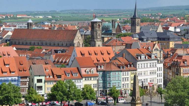Erfurt, with its half-timbered, many-steepled medieval townscape and shallow river...