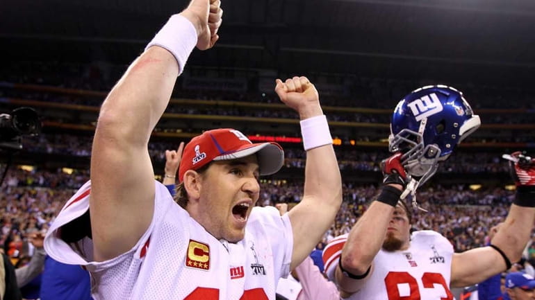 Giants quarterback Eli Manning reacts after watching the incomplete pass...