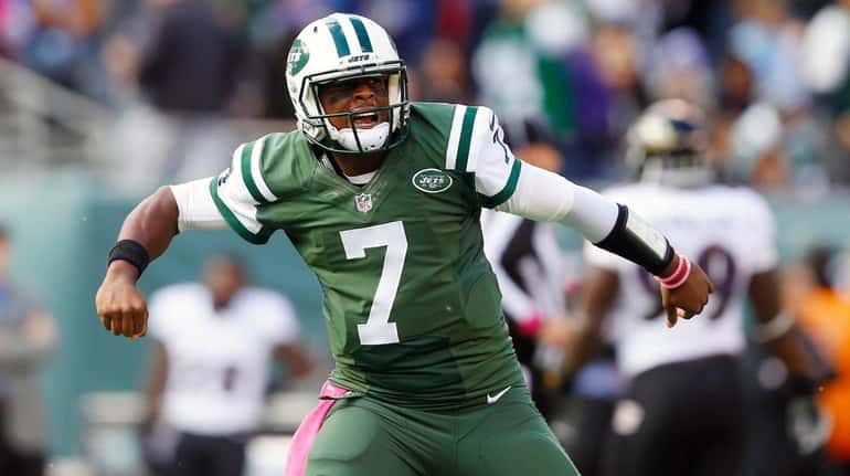 Geno Smith #7 of the New York Jets reacts after...