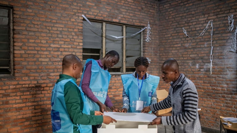 Election officials prepare ballot boxes in Goma, eastern Democratic Republic...