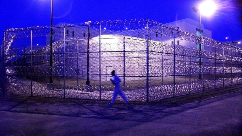 A police recruit jogs around the Nassau County Jail.