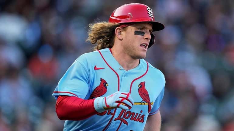 Harrison Bader runs to first base after hitting a single...