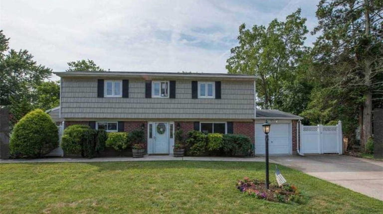 Priced at $649,000 and located on Haypath Road in Bethpage,...