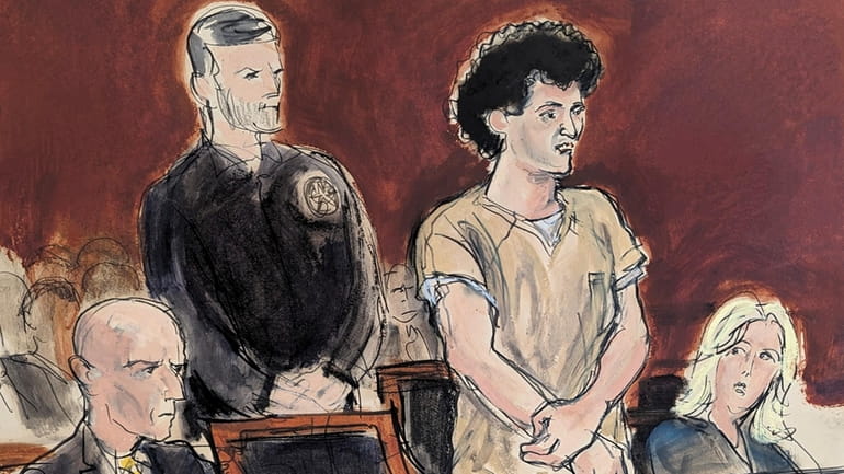In this courtroom sketch, Sam Bankman-Fried, second from right, stands...