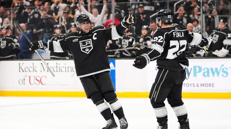 Los Angeles Kings left wing Kevin Fiala, right, celebrates his...
