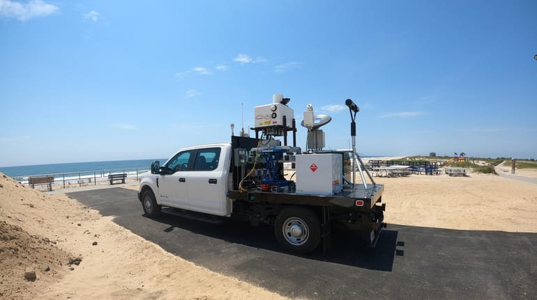 Brookhaven Lab's mobile measurement station collects data on atmospheric conditions...