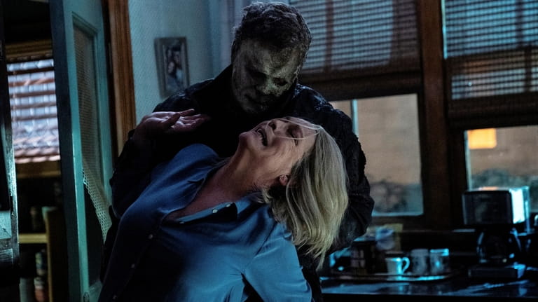 Michael Myers (aka The Shape) and Jamie Lee Curtis as...