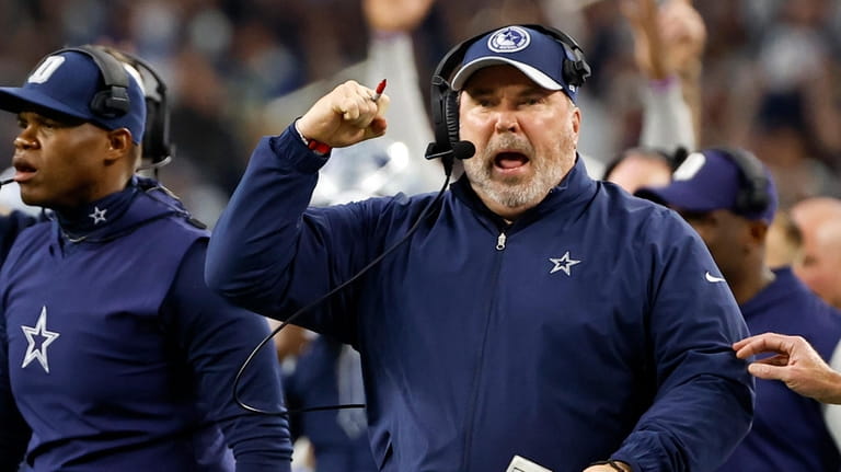 Dallas Cowboys head coach Mike McCarthy, celebrates after running back...