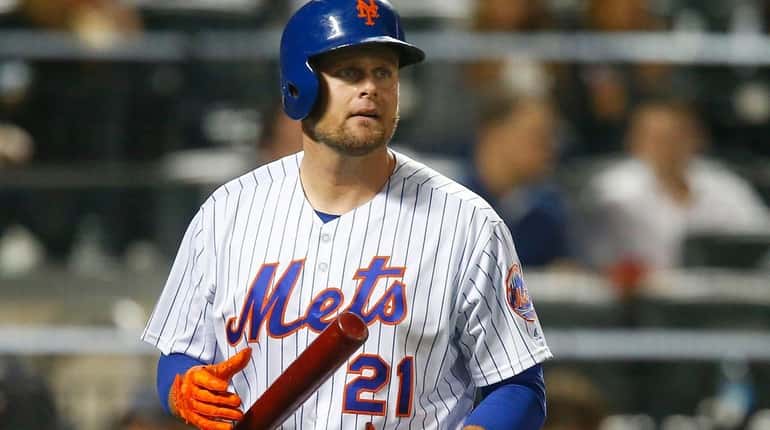 Lucas Duda of the Mets strikes out against the Nationals...