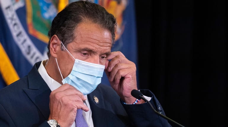 Gov. Andrew M. Cuomo wore a mask to protect against...