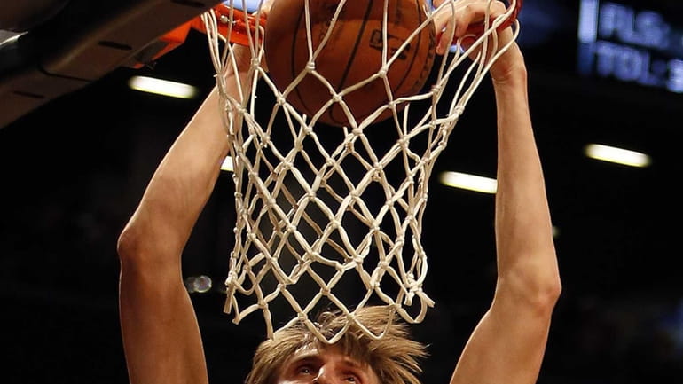 Andrei Kirilenko dunks in the second half of a game...