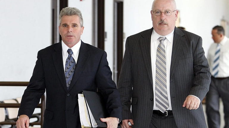 Detective John McLeer, left, of the Suffolk County Homicide Squad...