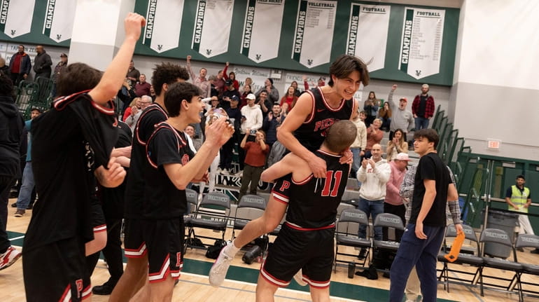 Pierson players celebrate their victory over Alexander Hamilton in the...