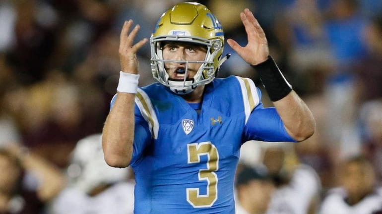 UCLA quarterback Josh Rosen gestures as if he was going...