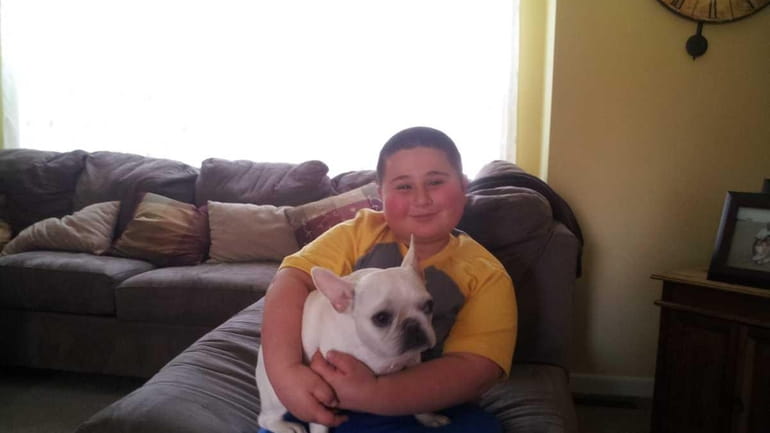 Ian Himmelstein, 8, of Manorville, with his French Bulldog, Jewel....