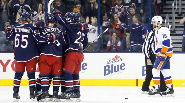 Columbus Blue Jackets players celebrate a goal against the New...