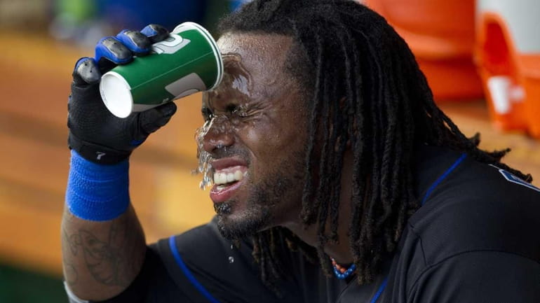 Jose Reyes cools off before the start of the game...