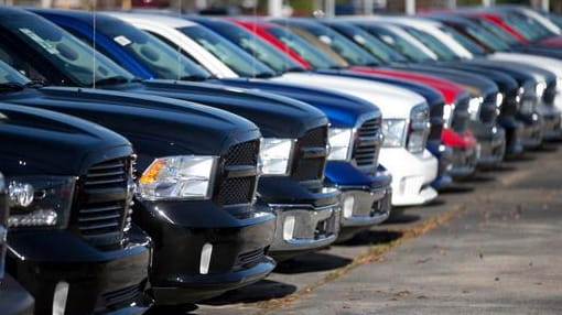 Ram pickup trucks are on display on the lot at...