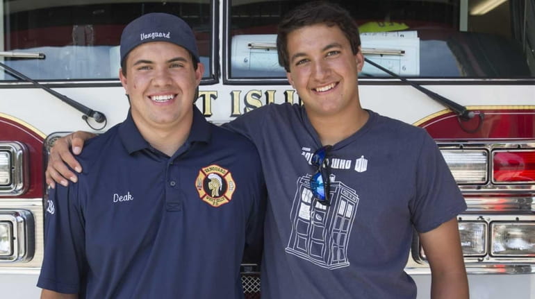West Islip volunteer firefighters Jason Deak, 21, left, and his...