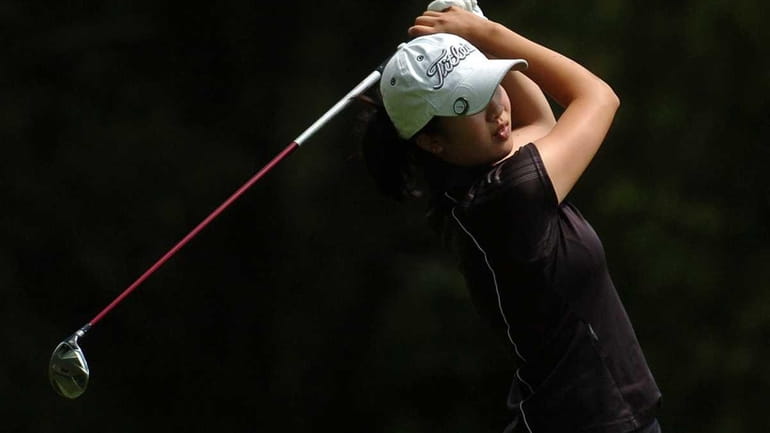 Tina Chang of St. Anthony's High School tees off on...