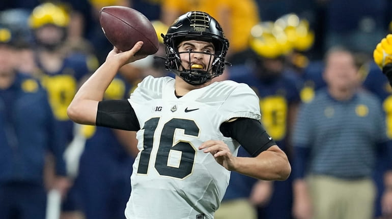 Purdue quarterback Aidan O'Connell throws during the first half of...