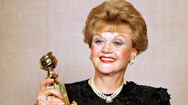 Angela Lansbury displays her Golden Globe Award for best actress...