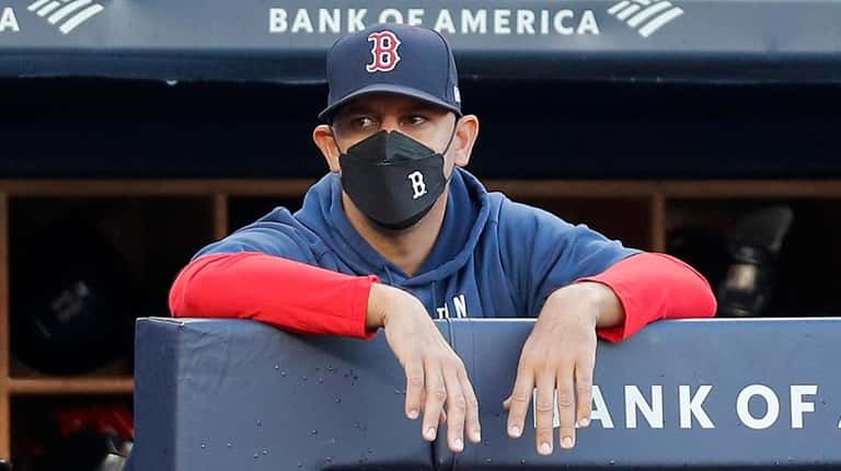 Red Sox manager Alex Cora looks on against the Yankees...