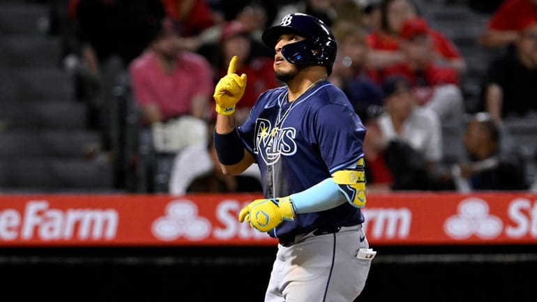 Tampa Bay Rays' Isaac Paredes reacts after hitting a solo...