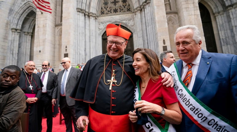 New York Gov. Kathy Hochul, center right, and Catholic Archbishop...