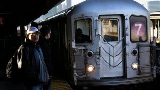 A 7 train enters a subway station in Queens on...