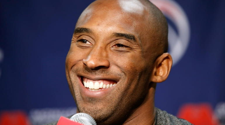 Lakers guard Kobe Bryant smiles during a media availability before...