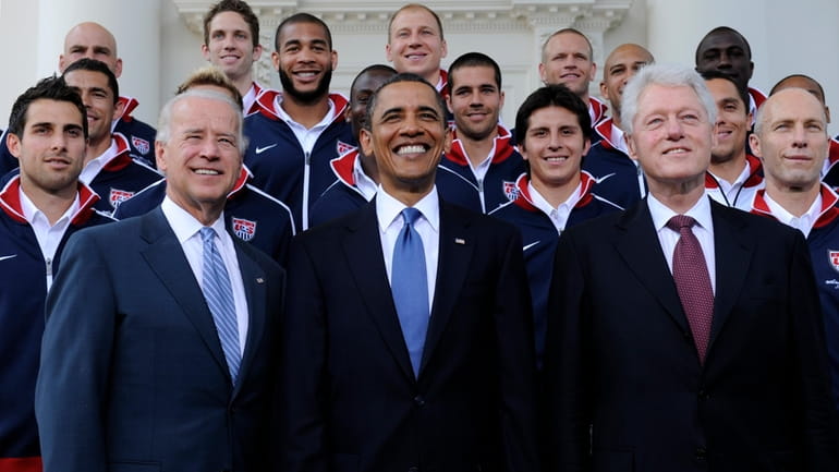 President Barack Obama, flanked by Vice President Joe Biden, left,...