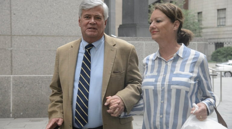 Dean Skelos and his wife, Gail, exit a federal courthouse in...