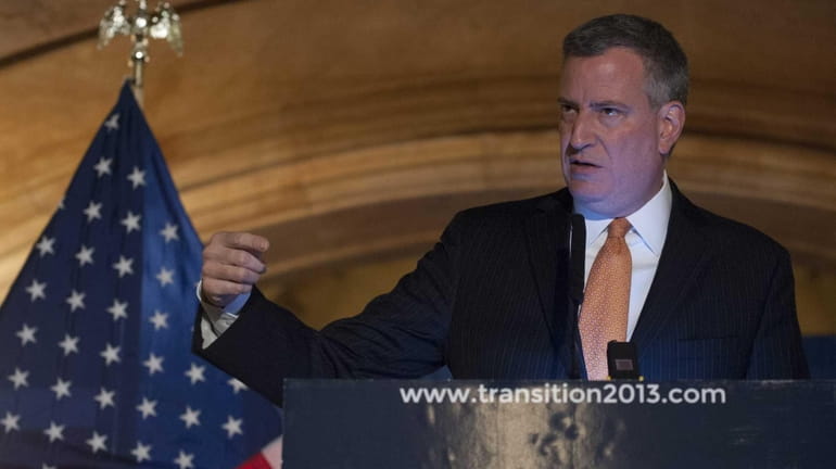 NYC Mayor-elect Bill de Blasio hosts a news conference at...